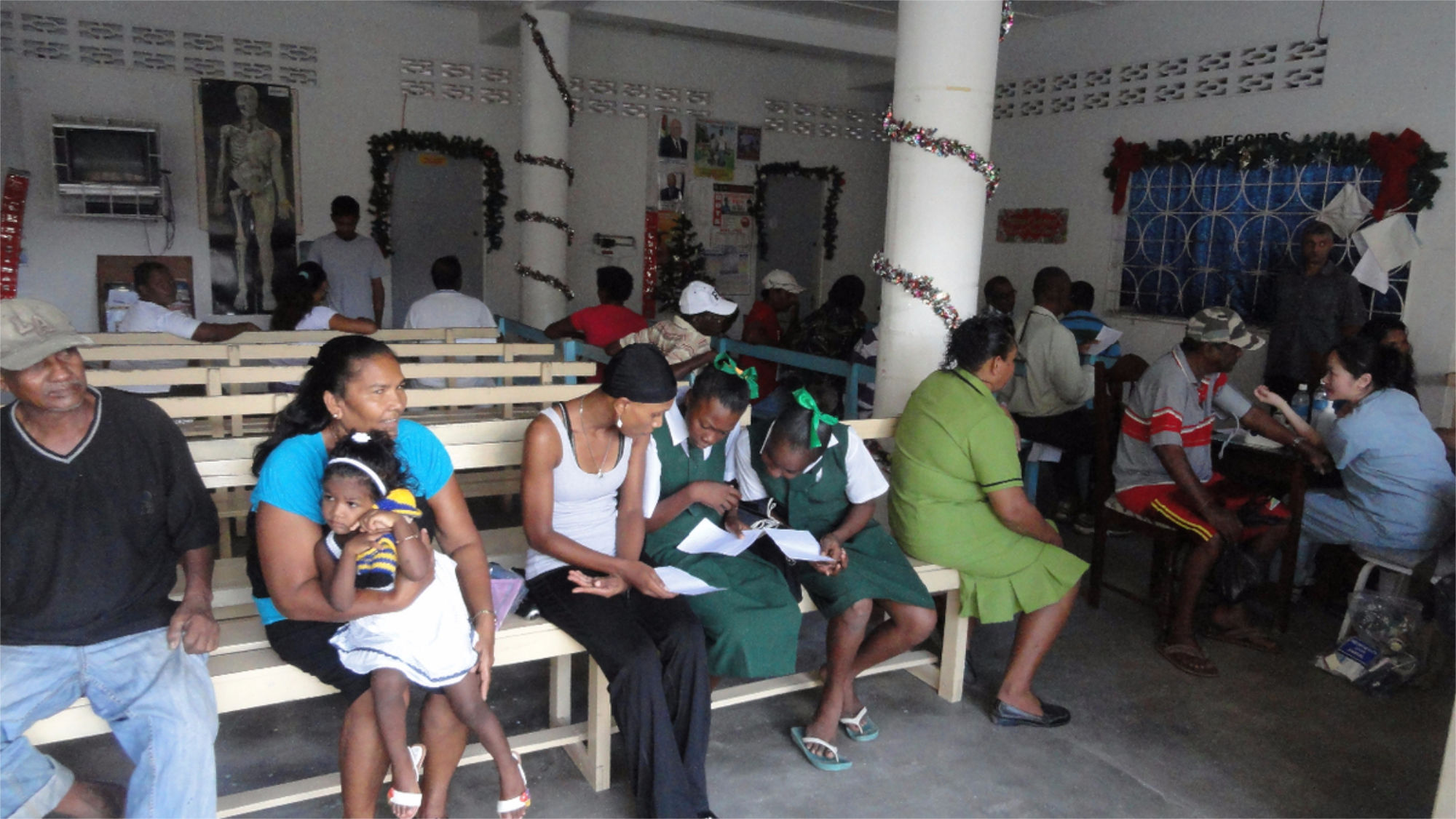 Group of people witing in line to see a comunity nurse